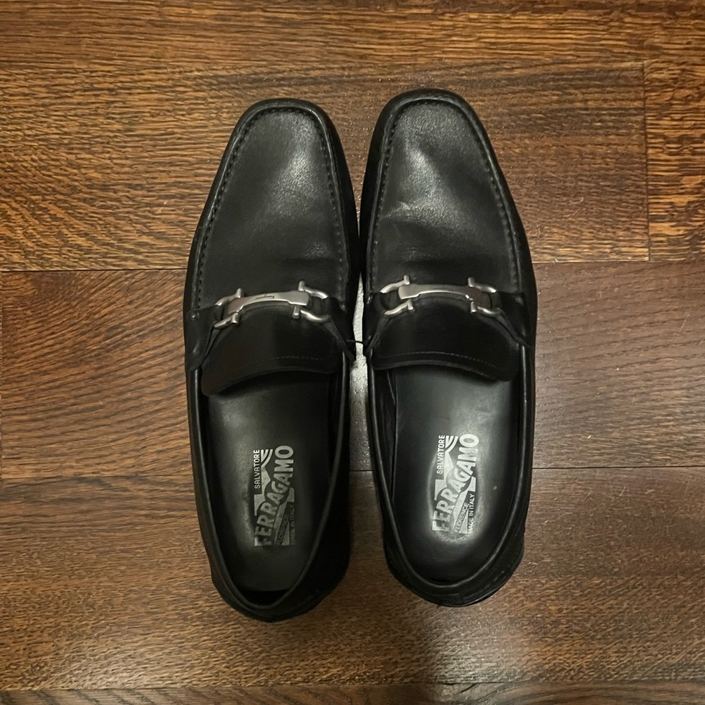 Salvatore Ferragamo black leather drivers with silver Gancini ornament.